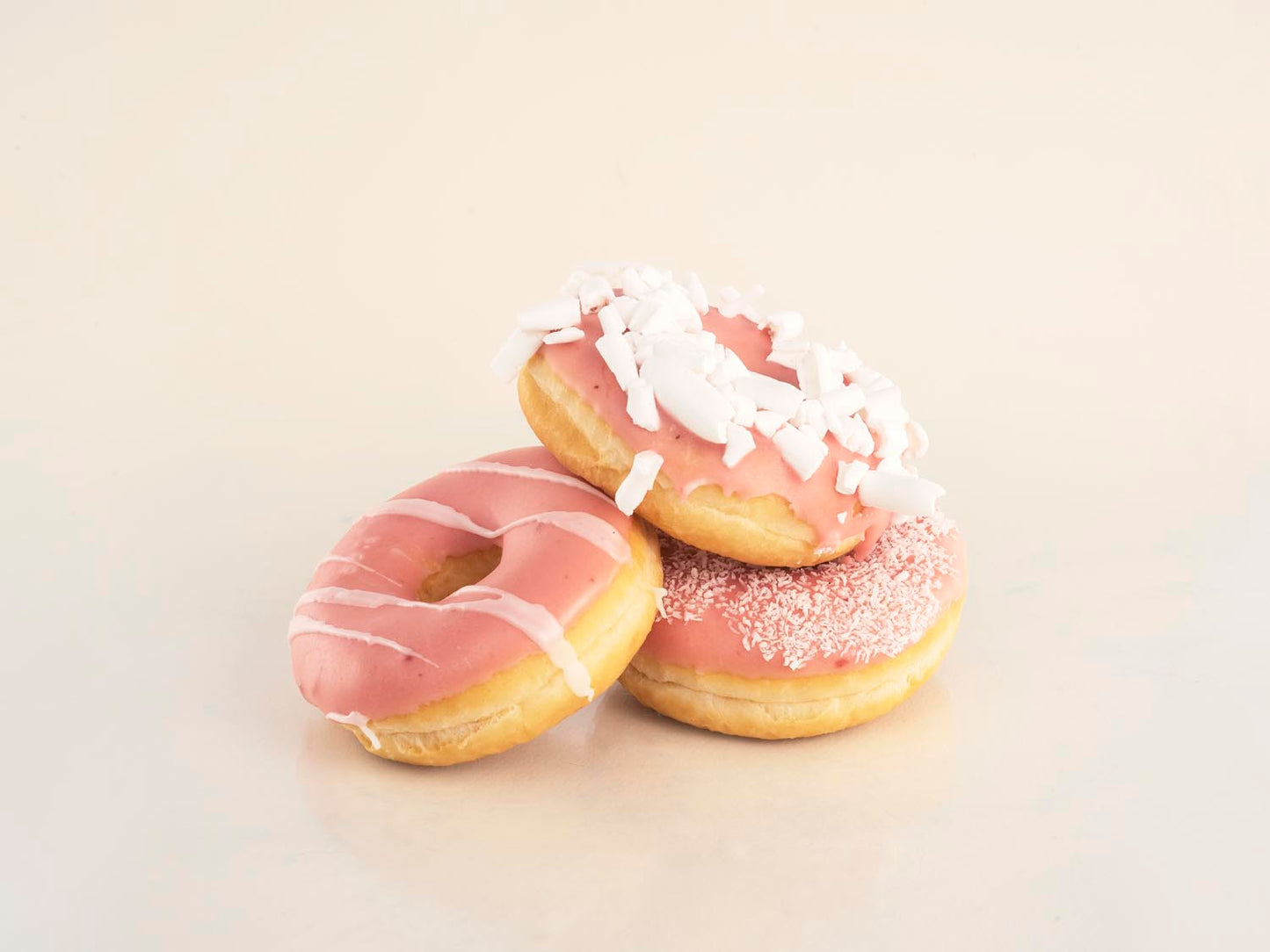 12 roze donuts